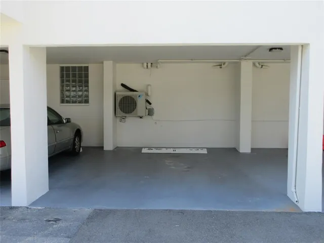 a view of a pathway both side of building with yard