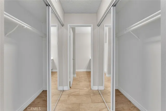 a view of room with door and windows