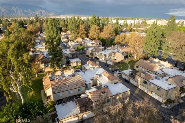 a view of a house with a yard and sitting area