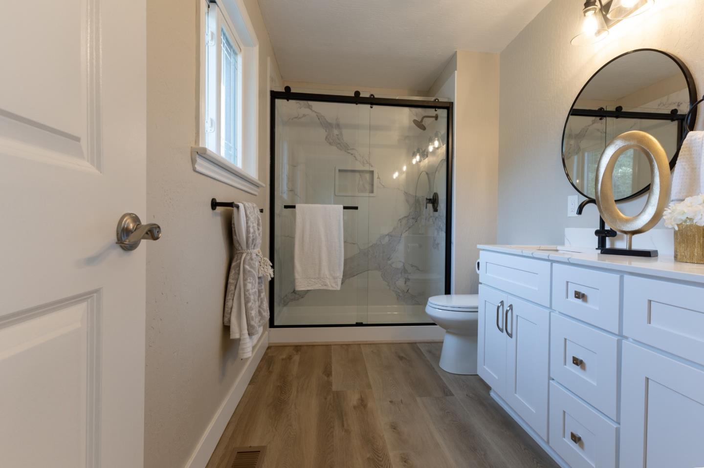 4030 St Marys Street Martinez, CA 94553 - Photo 18 of 28 a bathroom with a granite countertop sink toilet and shower
