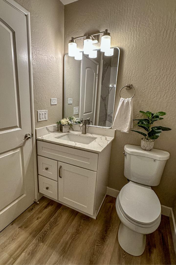 4030 St Marys Street Martinez, CA 94553 - Photo 20 of 28 a bathroom with a toilet sink and mirror