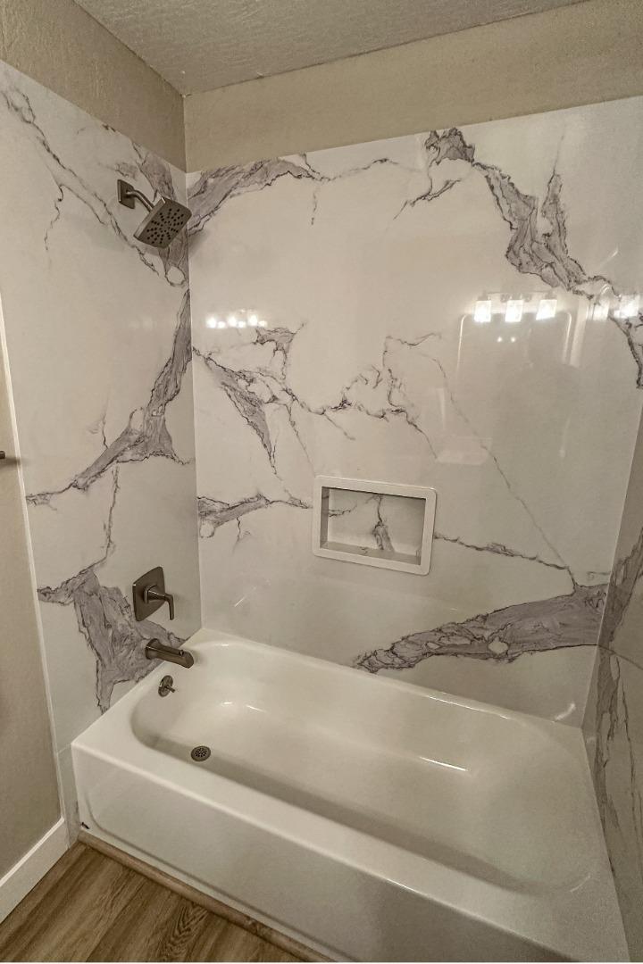 4030 St Marys Street Martinez, CA 94553 - Photo 21 of 28 a bathroom with a tub sink and vanity