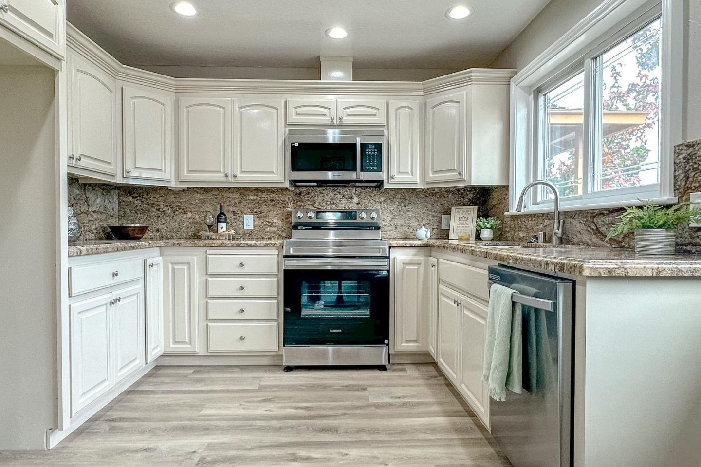 4030 St Marys Street Martinez, CA 94553 - Photo 4 of 28 a kitchen with stainless steel appliances granite countertop a stove sink and cabinets