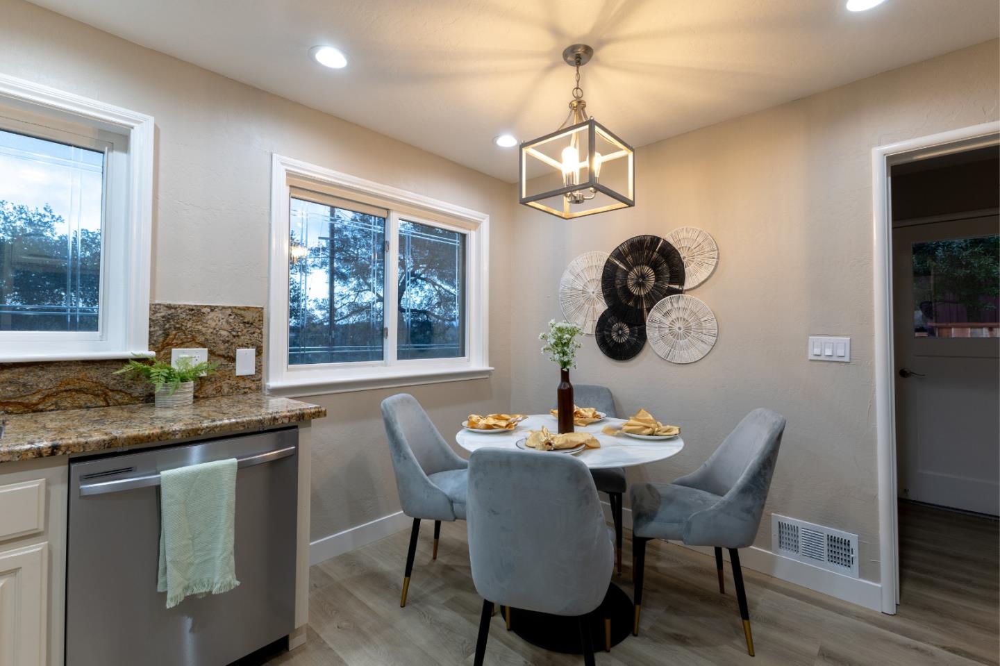 4030 St Marys Street Martinez, CA 94553 - Photo 6 of 28 a dining room with wooden floor a chandelier a wooden table and chairs