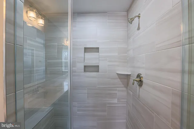 a view of room with air conditioner duct and materials on floor