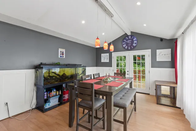 a outdoor dining space with furniture and window