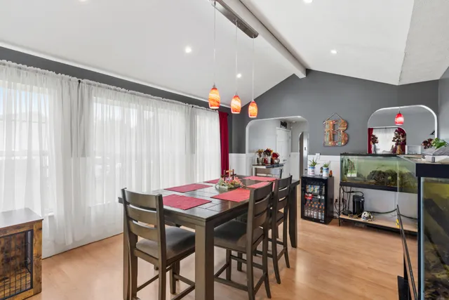 a dining room with furniture and window