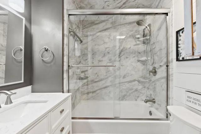a bathroom with a bathtub and a shower