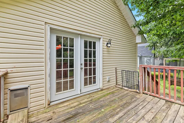 a view of a deck with a large window
