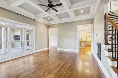 a kitchen with stainless steel appliances kitchen island granite countertop a refrigerator and a stove top oven