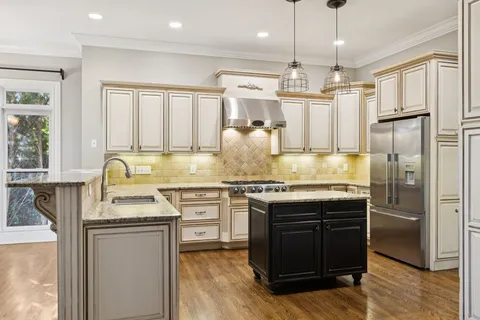 a view of a livingroom with a fireplace and window
