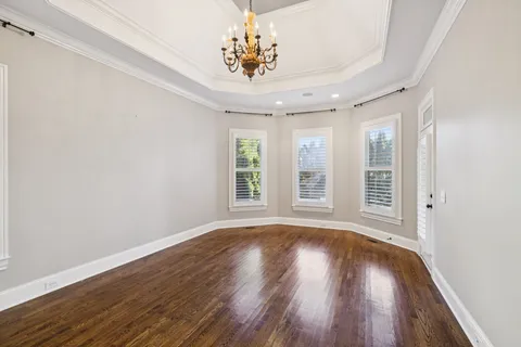 a bathroom with a granite countertop sink a mirror and a shower