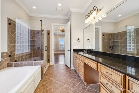 a view of an empty room and window with wooden floor