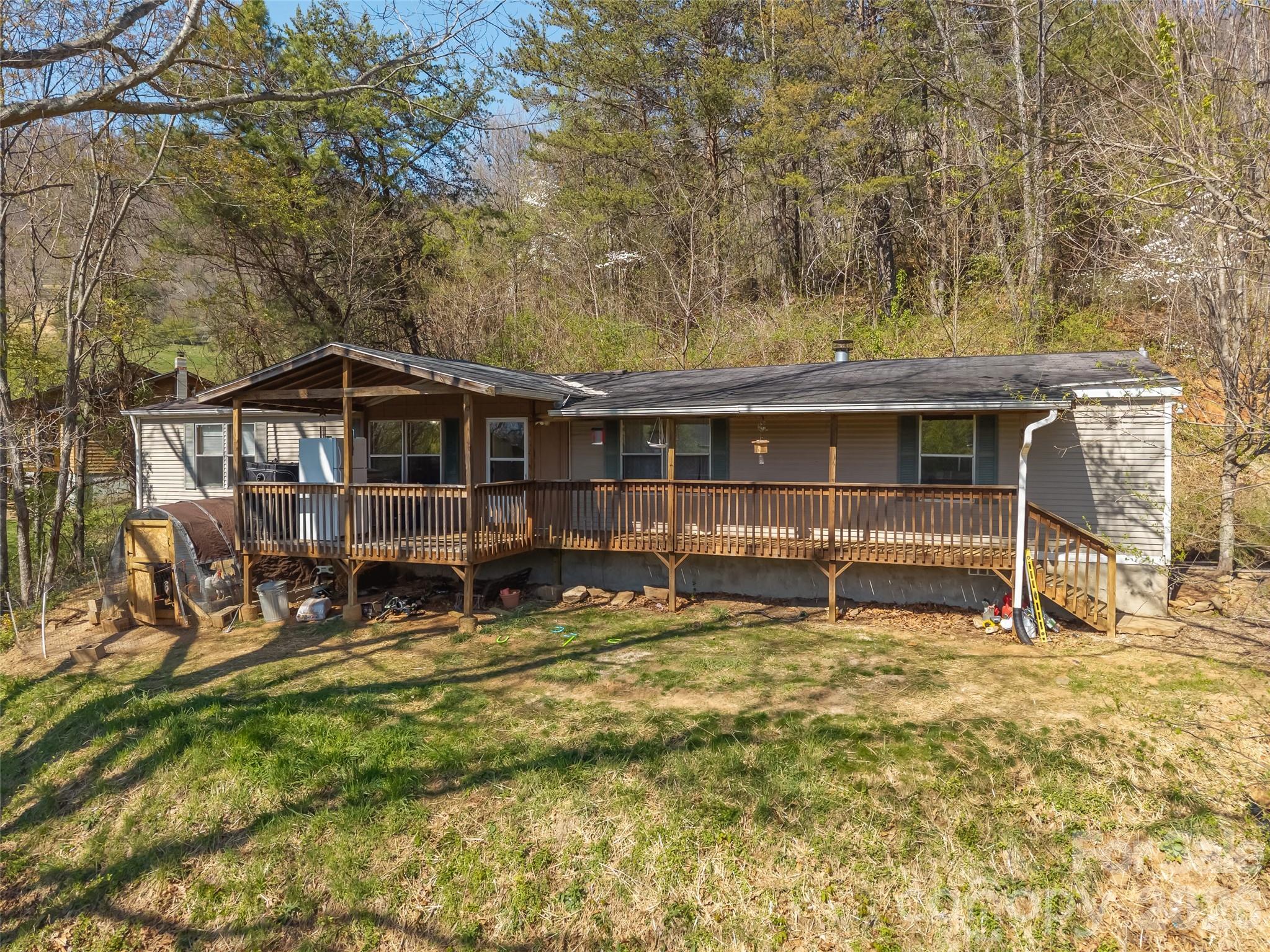 a view of a house with backyard porch and sitting area