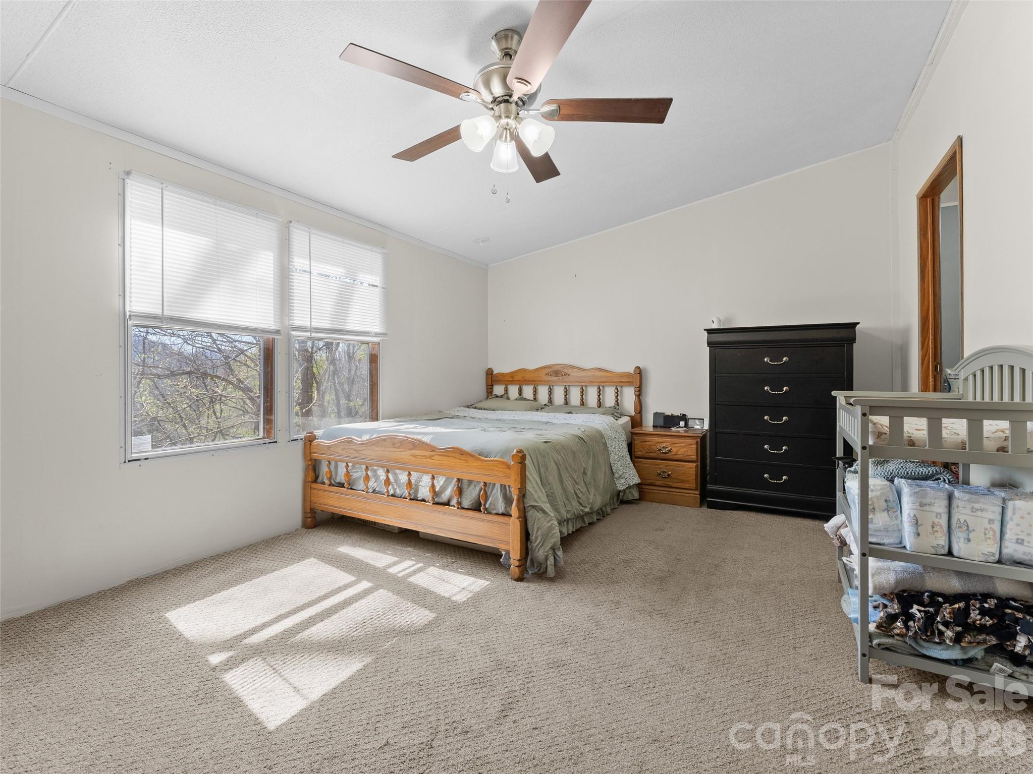 301 Matthew Lane Canton, NC 28716 - Photo 12 of 29 a bedroom with a bed dresser and a window