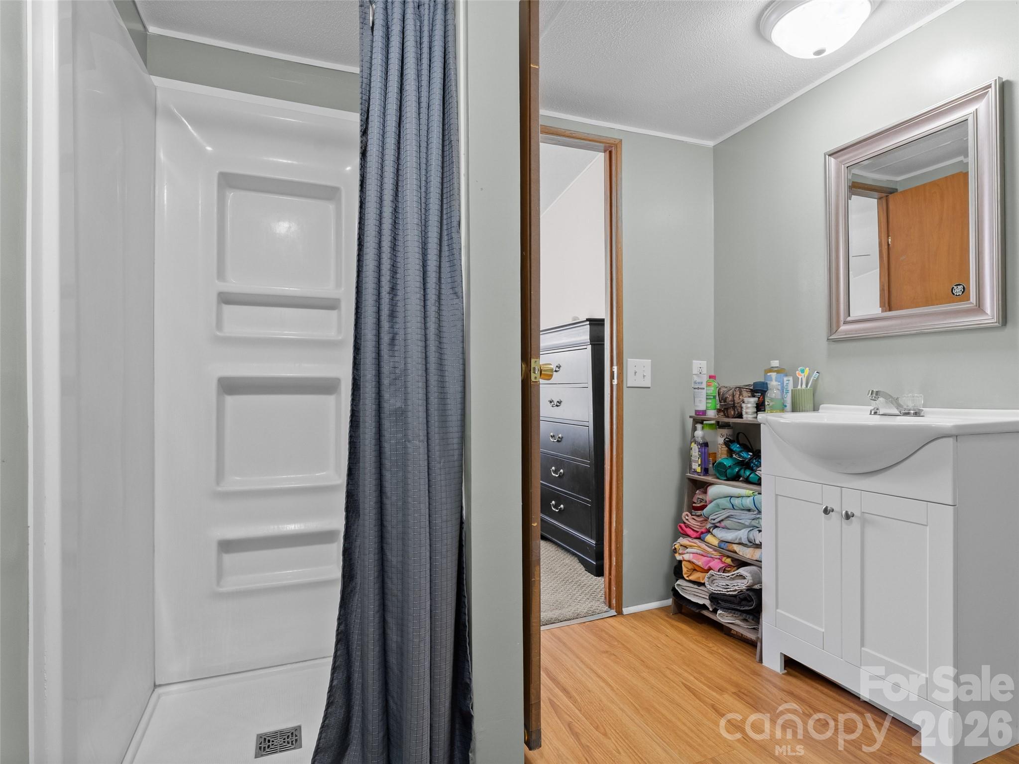 301 Matthew Lane Canton, NC 28716 - Photo 15 of 29 a view of a bedroom with a bed and workspace