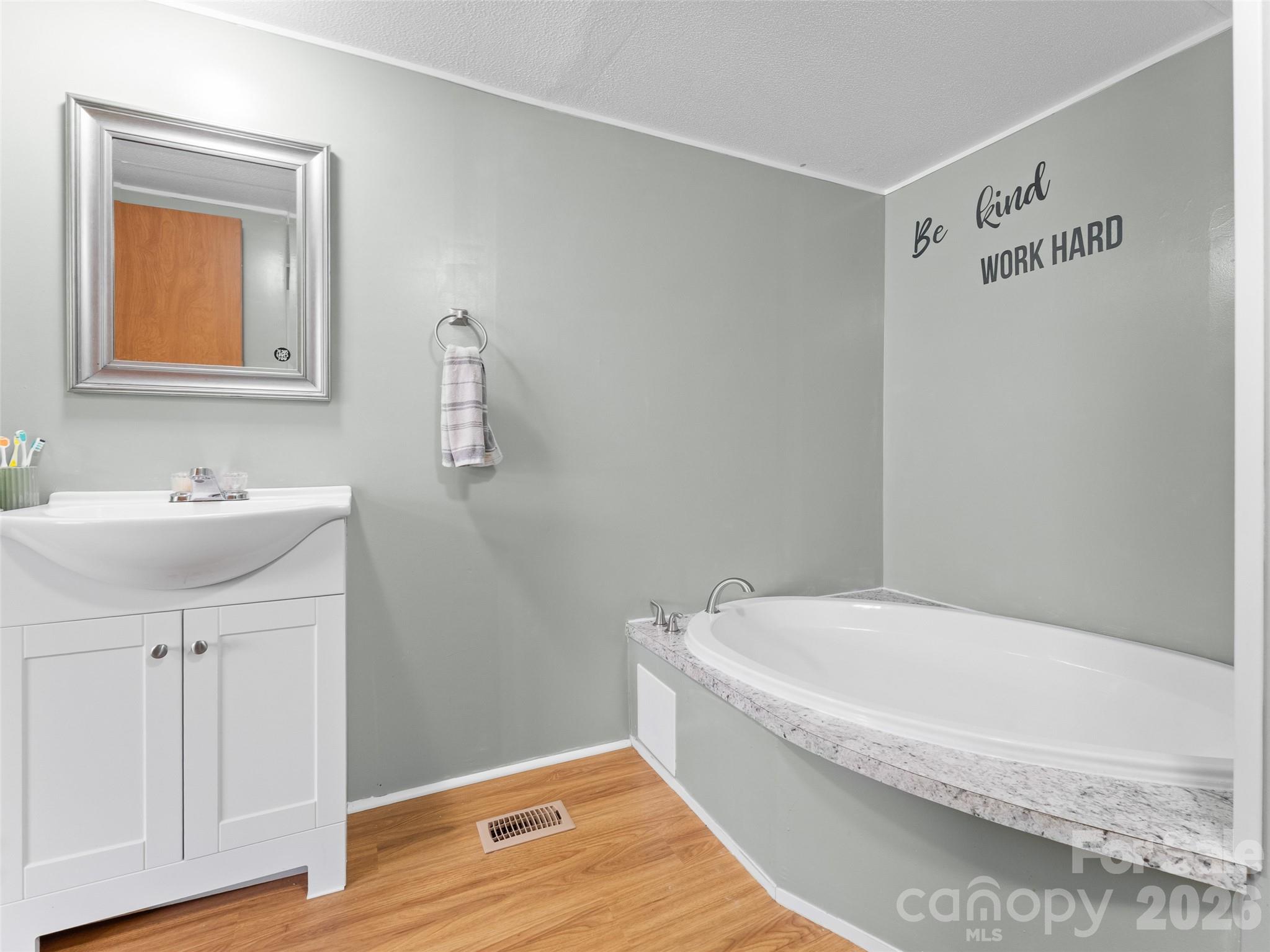 301 Matthew Lane Canton, NC 28716 - Photo 16 of 29 a bathroom with a bathtub and a sink