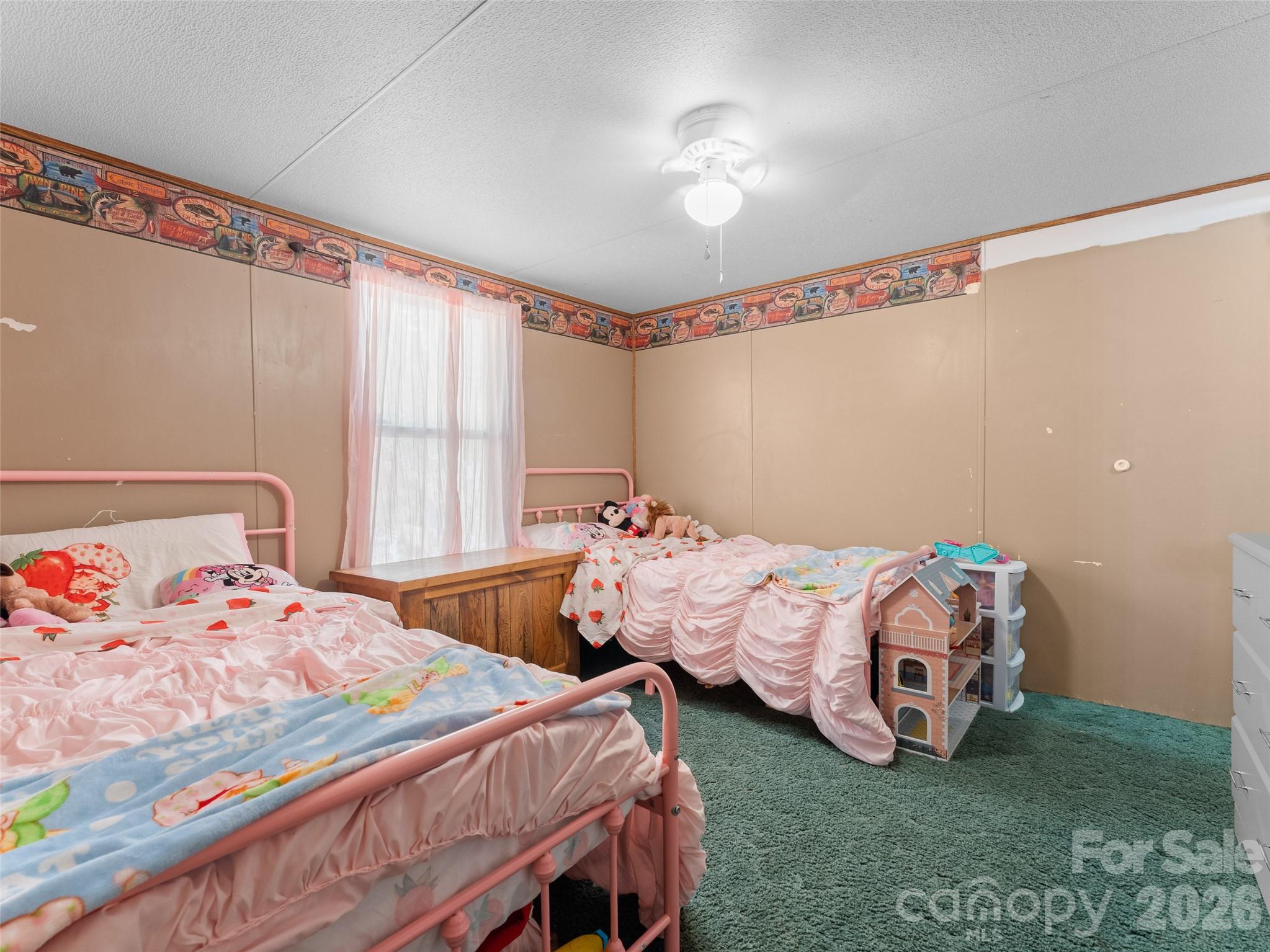 301 Matthew Lane Canton, NC 28716 - Photo 20 of 29 a bedroom with two beds and a baby crib
