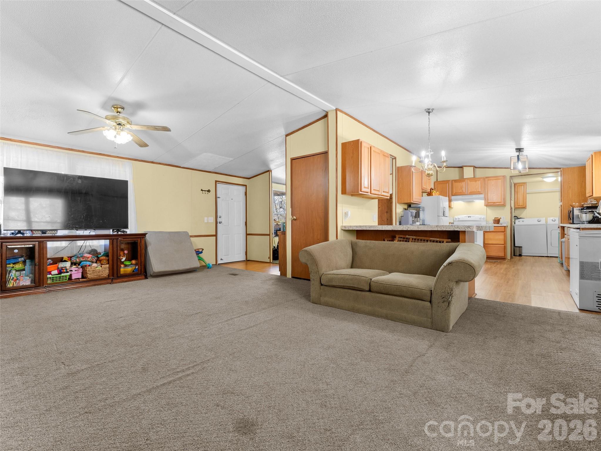 301 Matthew Lane Canton, NC 28716 - Photo 4 of 29 a living room with furniture and a flat screen tv