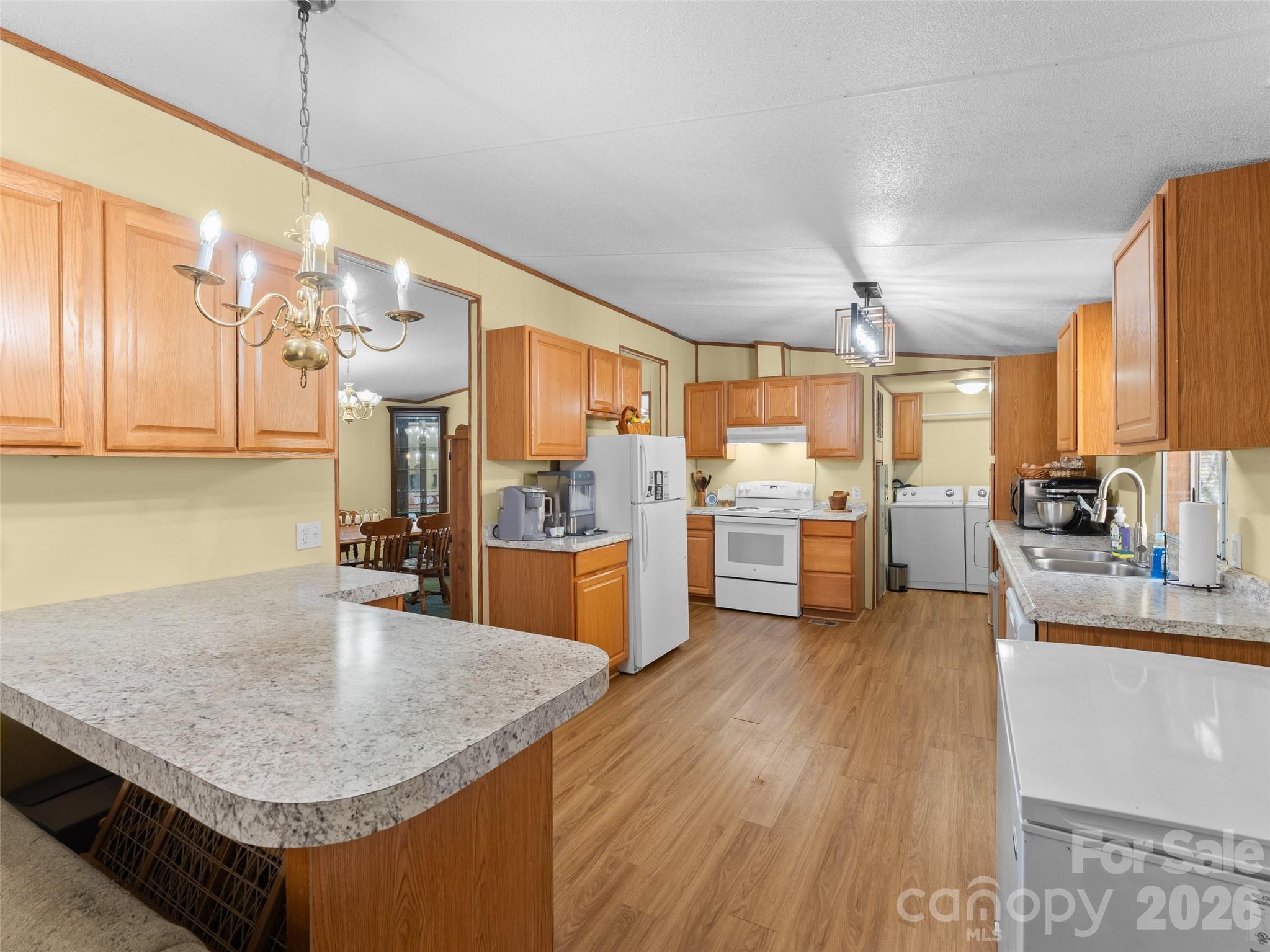 301 Matthew Lane Canton, NC 28716 - Photo 5 of 29 a kitchen with stainless steel appliances granite countertop a sink counter space and wooden floor