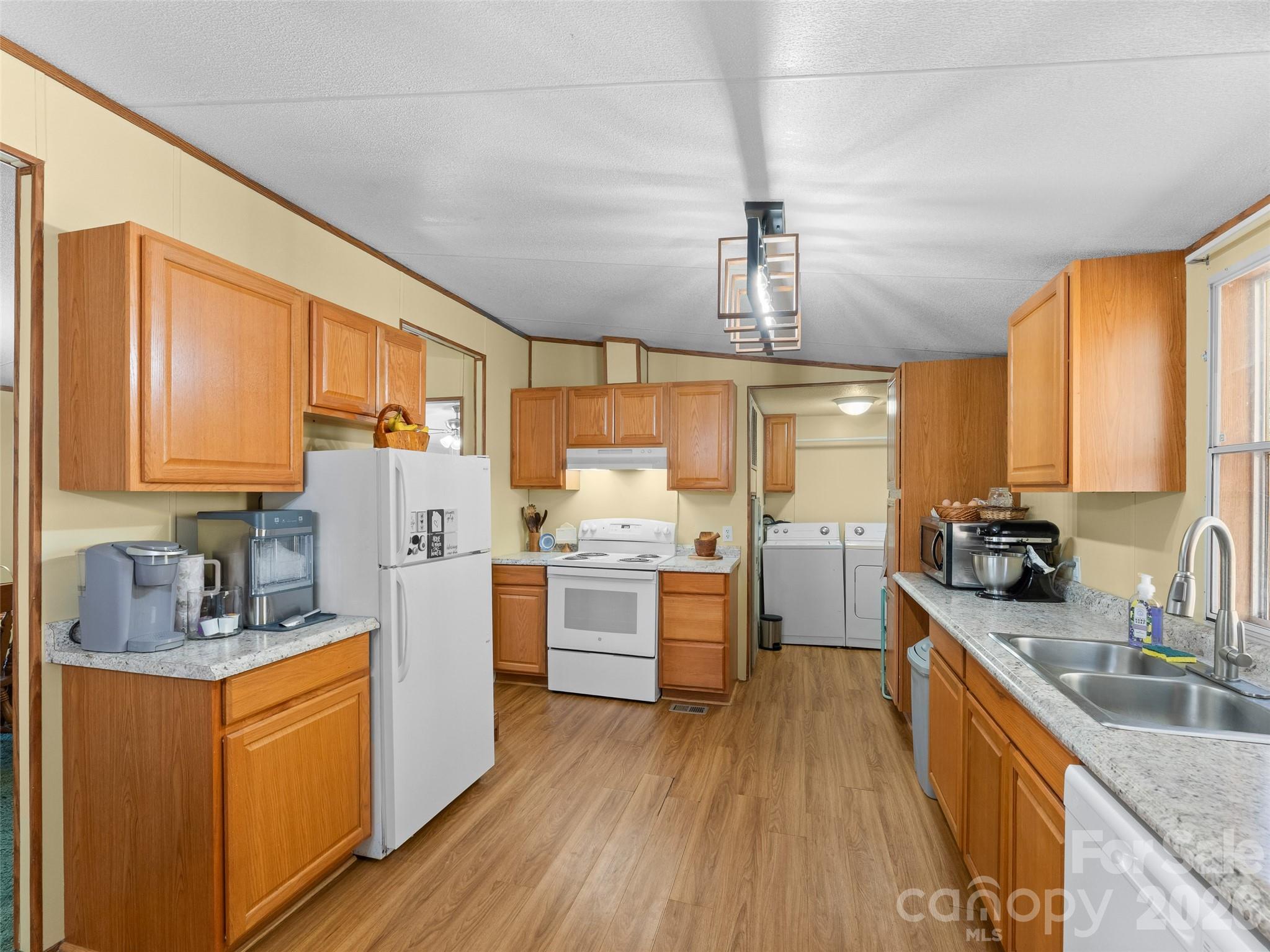 301 Matthew Lane Canton, NC 28716 - Photo 8 of 29 a kitchen with refrigerator cabinets and wooden floor