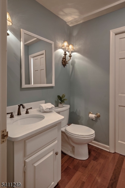 301 Hilltop Road Mendham, NJ 07945 - Photo 23 of 34 a bathroom with a toilet sink and mirror