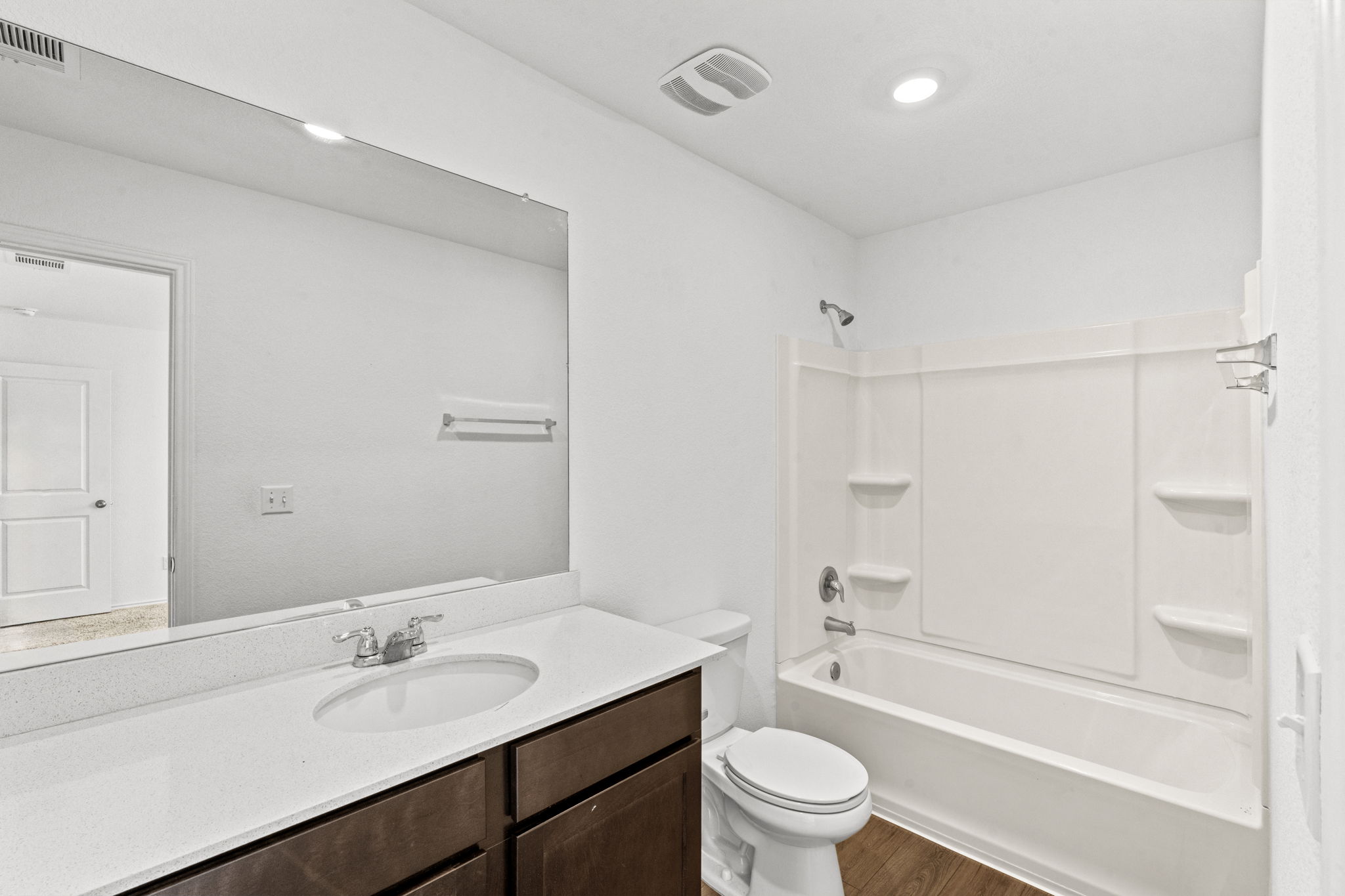 889 Powell Kyle, TX 78640 - Photo 11 of 22 Clean lines and a spacious vanity define this modern, functional bathroom.