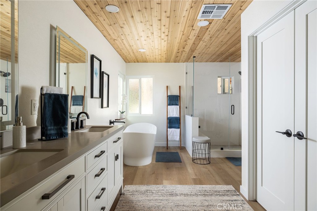 602 Calle Ganadero San Clemente, CA 92673 - Photo 20 of 42 a spacious bathroom with a granite countertop sink a mirror and shower