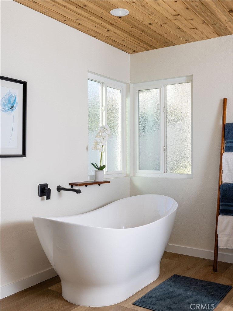 602 Calle Ganadero San Clemente, CA 92673 - Photo 21 of 42 a white tub sitting in a bathroom next to a window
