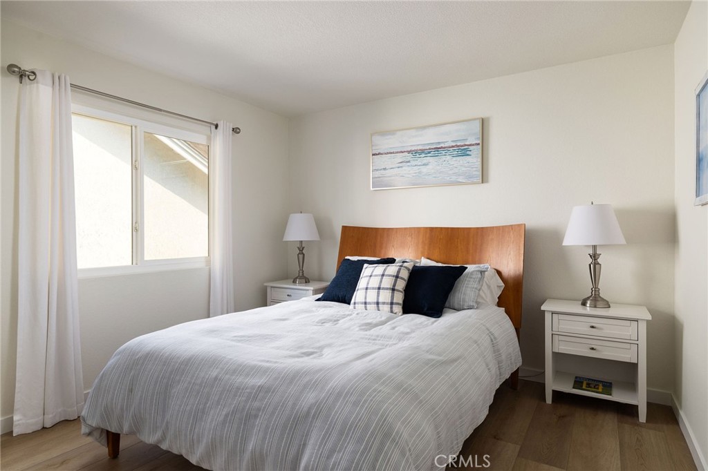 602 Calle Ganadero San Clemente, CA 92673 - Photo 25 of 42 a bedroom with a bed and a lamp on table
