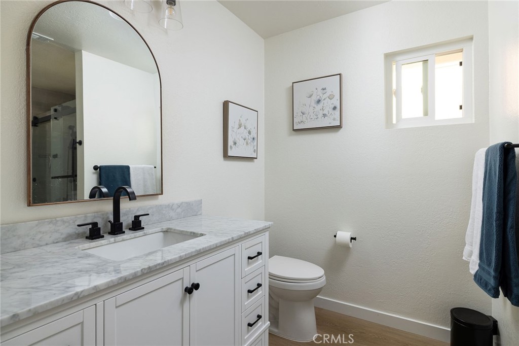 602 Calle Ganadero San Clemente, CA 92673 - Photo 28 of 42 a bathroom with a toilet sink and mirror
