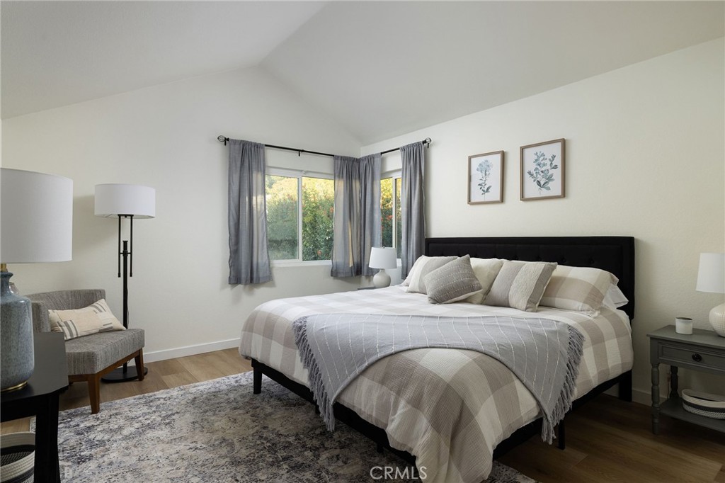 602 Calle Ganadero San Clemente, CA 92673 - Photo 29 of 42 a bedroom with a bed and wooden floor