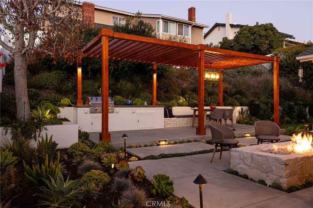 602 Calle Ganadero San Clemente, CA 92673 - Photo 34 of 42 a view of a patio with table and chairs potted plants