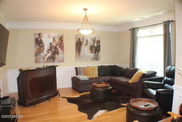 a living room with furniture a couch and a window