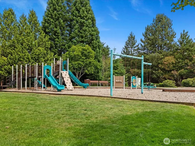a view of a house with backyard and porch