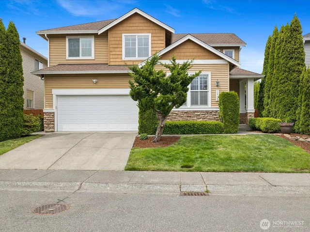 front view of a house and a yard