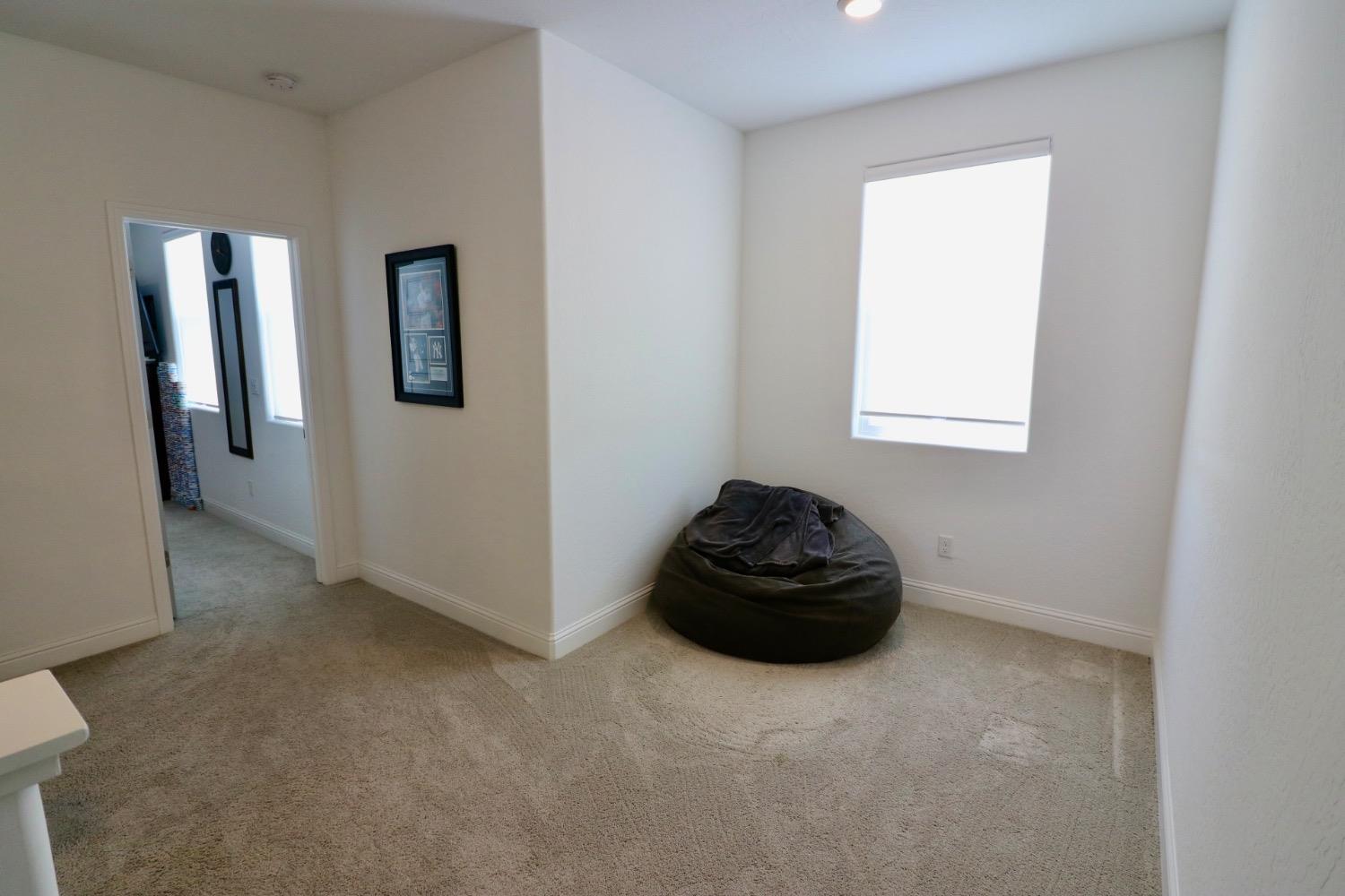 240 Huntington Avenue Madera, CA 93636 - Photo 11 of 24 a room with a rug and white walls