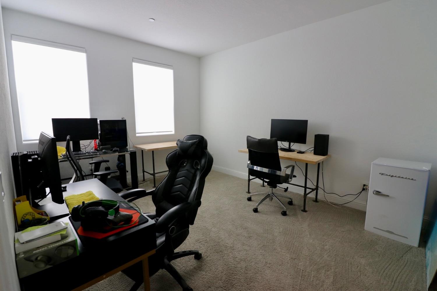 240 Huntington Avenue Madera, CA 93636 - Photo 12 of 24 a view of a workspace with furniture and a window