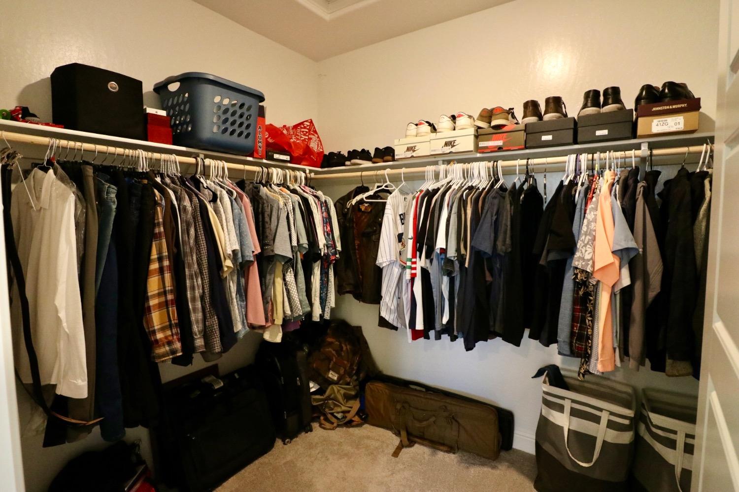 240 Huntington Avenue Madera, CA 93636 - Photo 14 of 24 a view of walk in closet with clothes and shoes