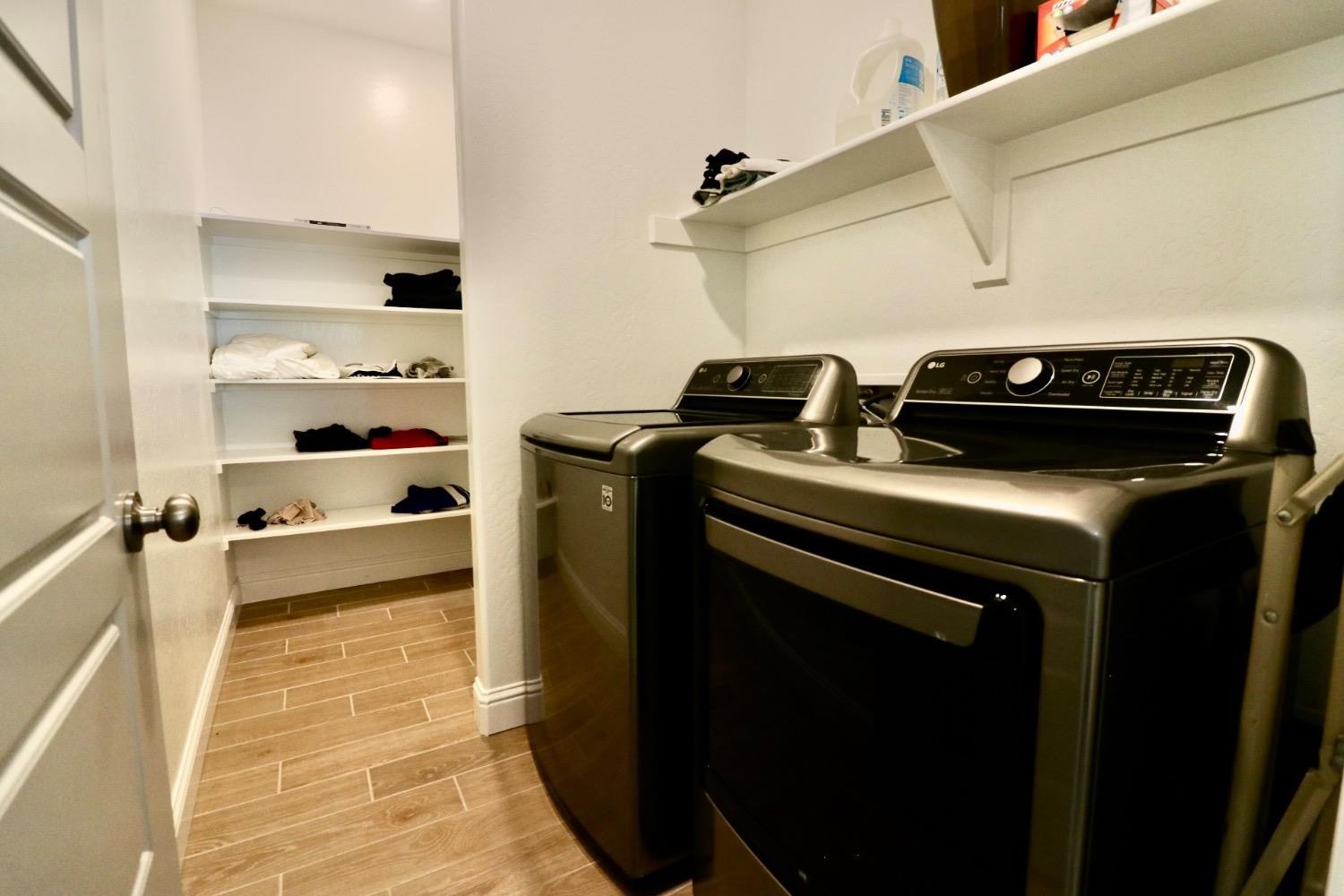 240 Huntington Avenue Madera, CA 93636 - Photo 16 of 24 a kitchen with a stove and a refrigerator