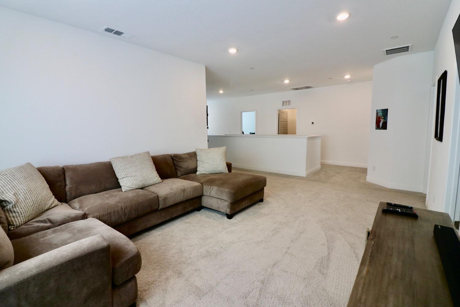 240 Huntington Avenue Madera, CA 93636 - Photo 18 of 24 a living room with furniture and a couch