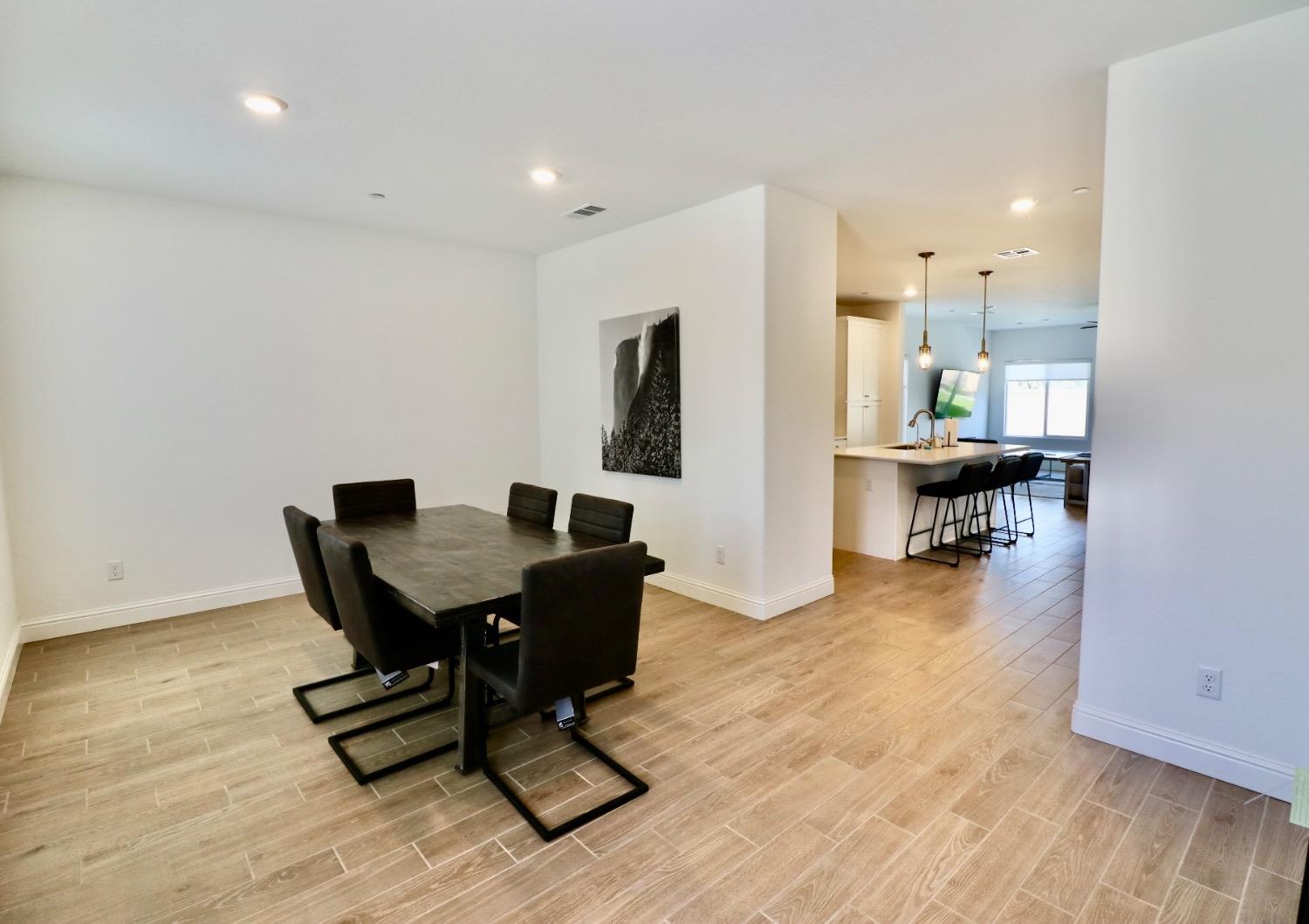 240 Huntington Avenue Madera, CA 93636 - Photo 2 of 24 a view of a dining room with furniture and wooden floor