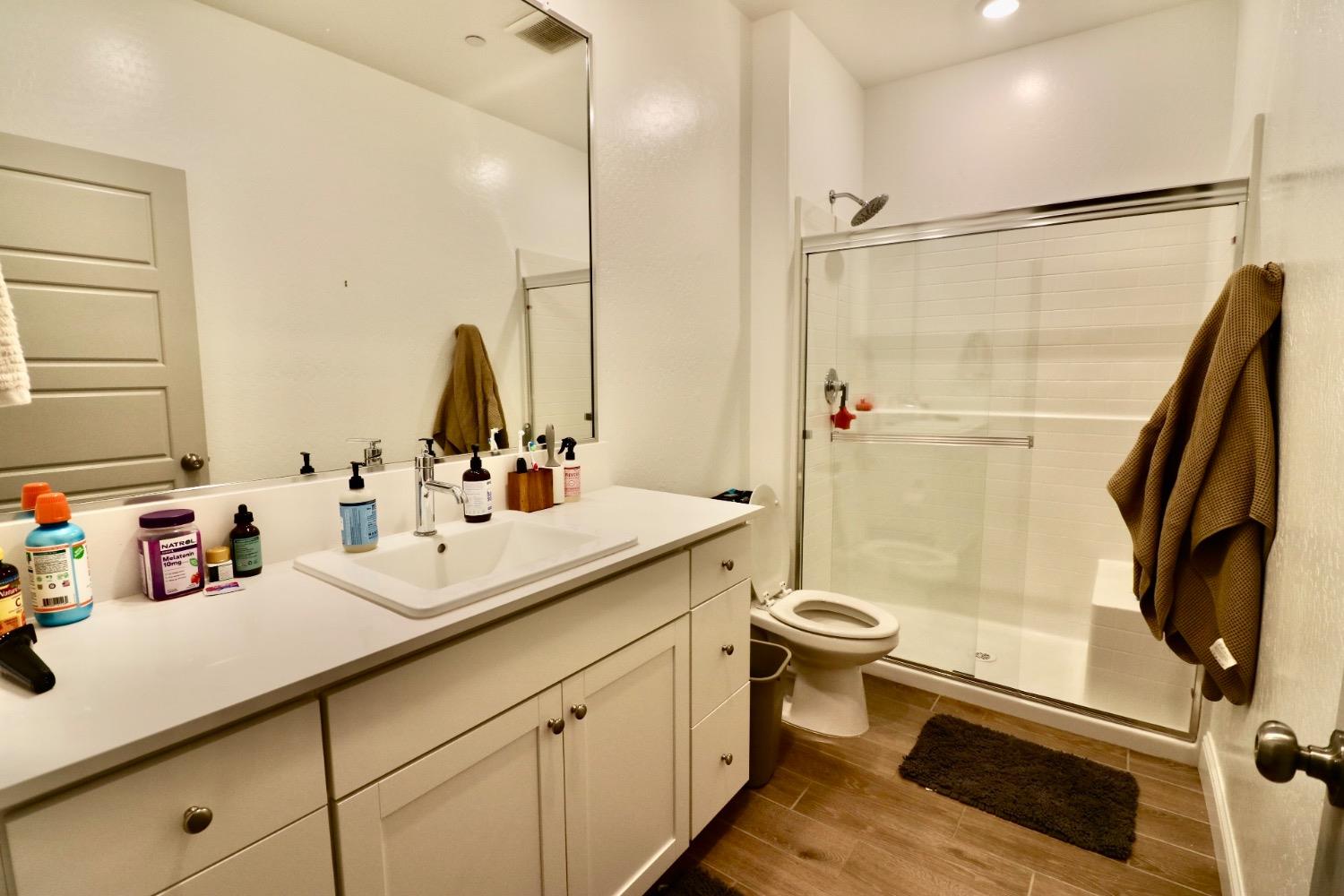 240 Huntington Avenue Madera, CA 93636 - Photo 6 of 24 a bathroom with a sink toilet and shower