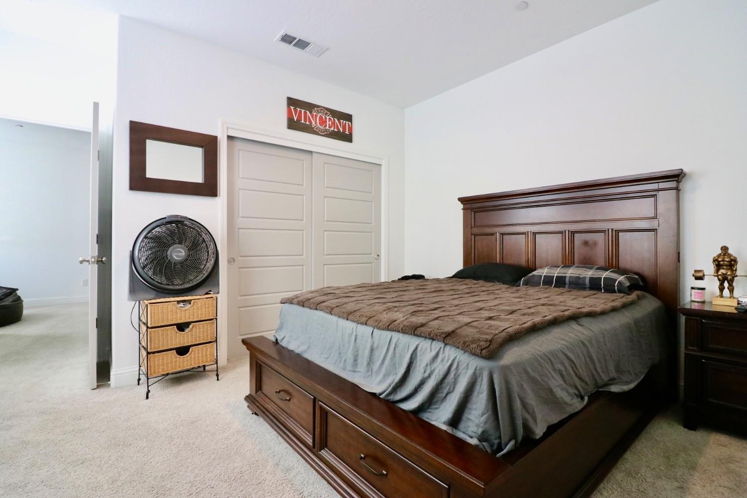 240 Huntington Avenue Madera, CA 93636 - Photo 8 of 24 a bedroom with a bed and a closet