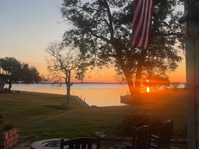a view of lake with green space