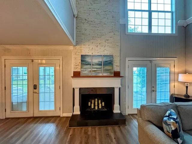 a living room with furniture and a fireplace