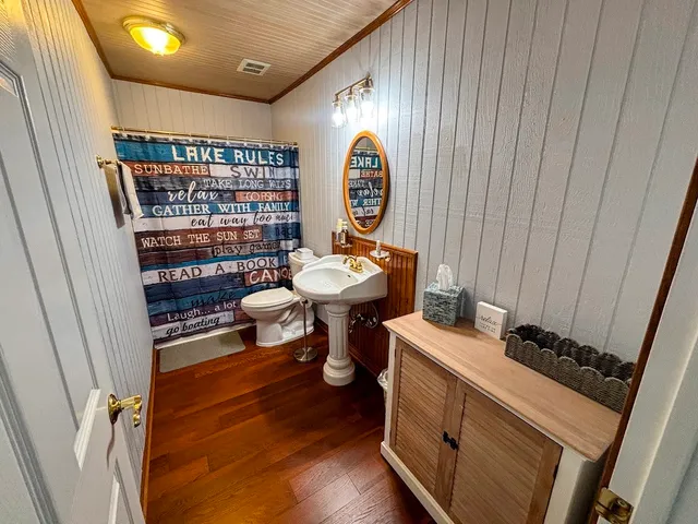 a view of living room with baby crib furniture and a window