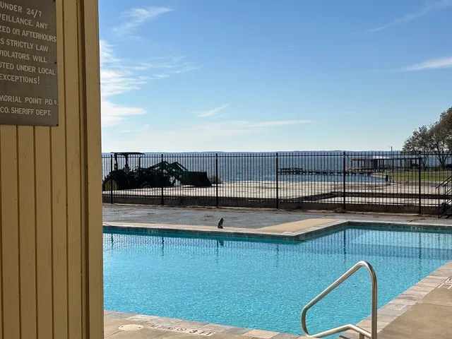 a view of a living room and kitchen
