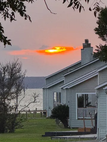 a view of grassy field with trees