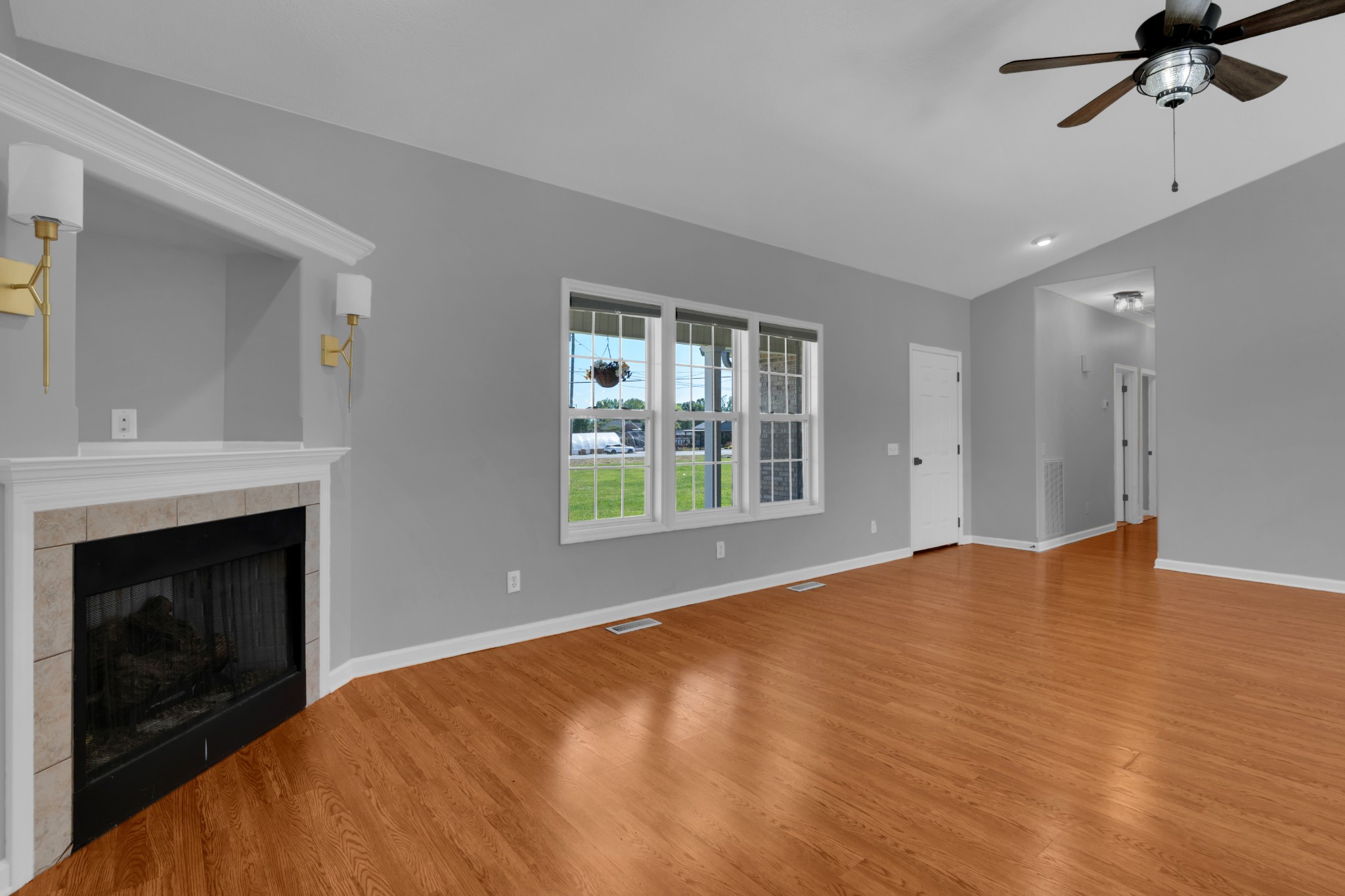 3896 Lynchburg Road Winchester, TN 37398 - Photo 8 of 57 a view of an empty room with a fireplace and a window
